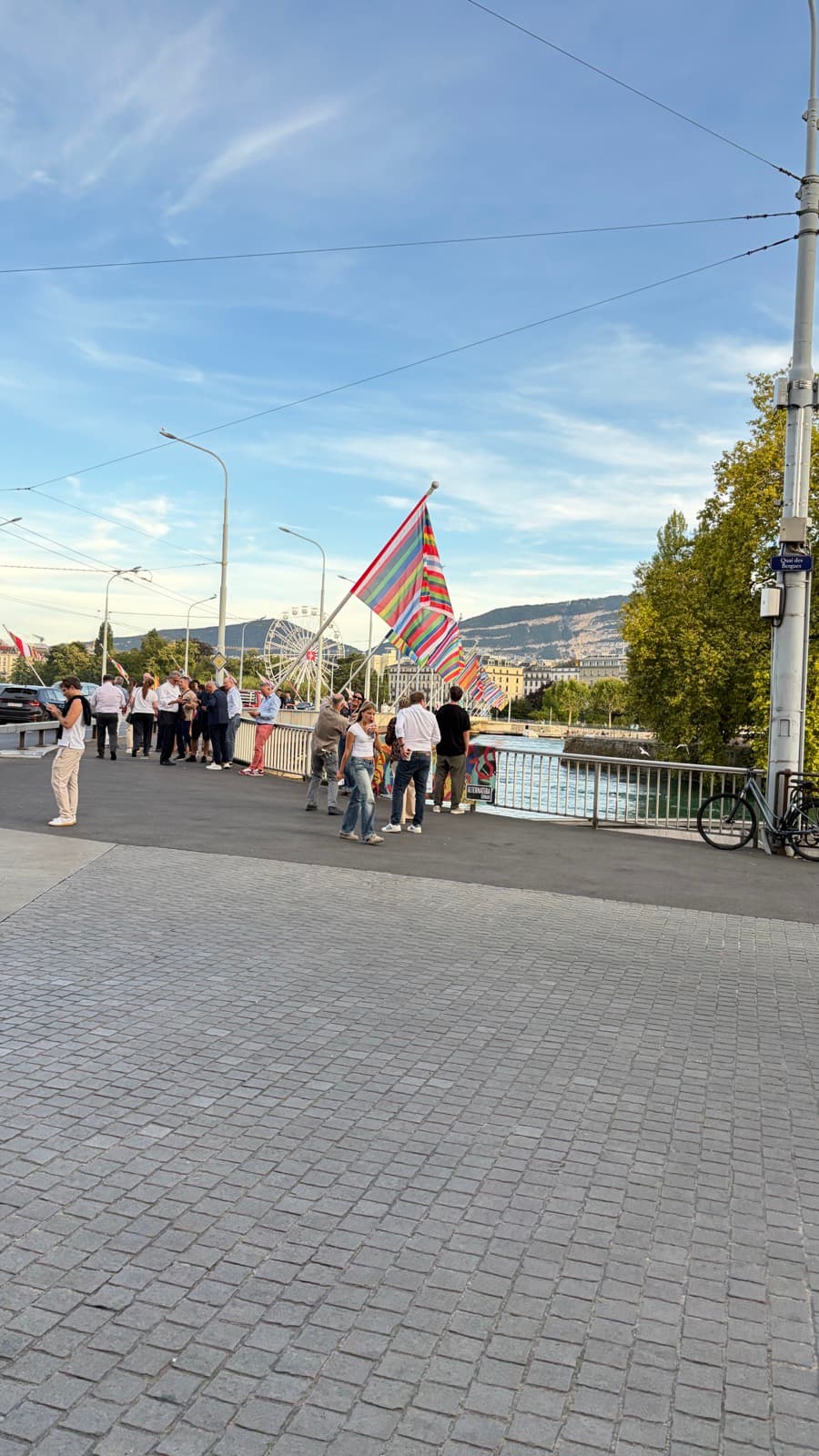 GDC flags and attendees on Quai des Bergues in Geneva